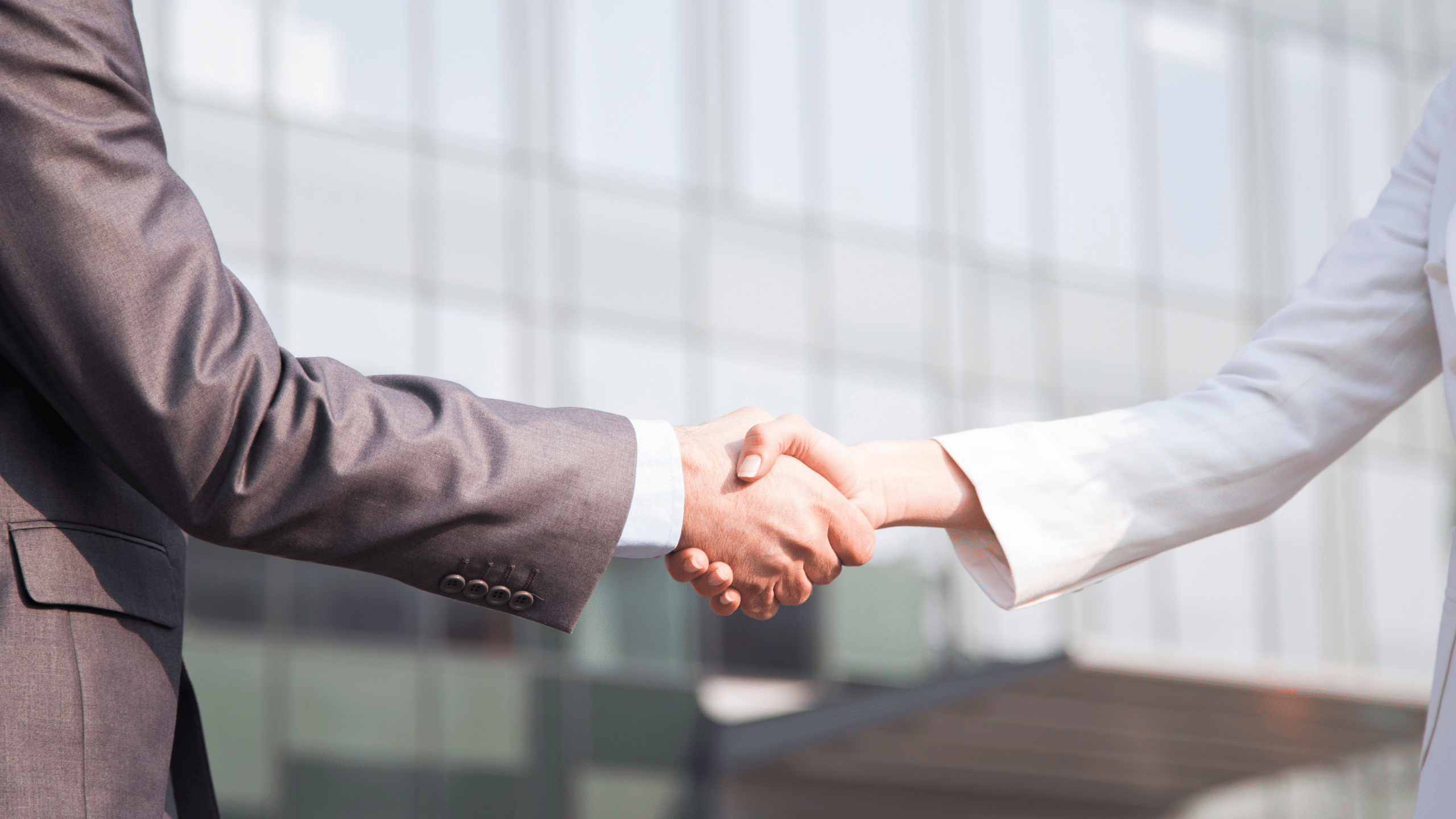 blog header image - businessman and businesswoman shaking hands